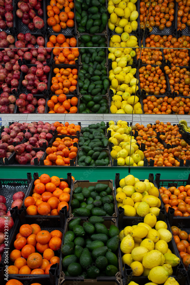 Boxes with fruit on the counter of shop..