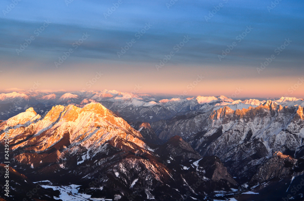 Aerial view of Alpine peaks over Austria in sunset