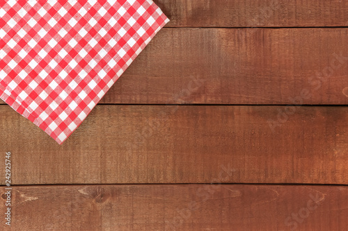 Wooden table and red tablecloth or napkin