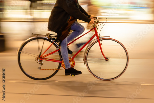 bicycle rider in the city at night