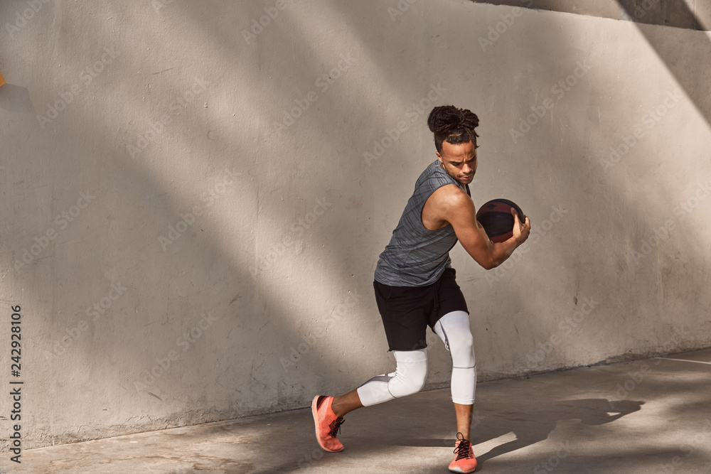 young man working out with ball