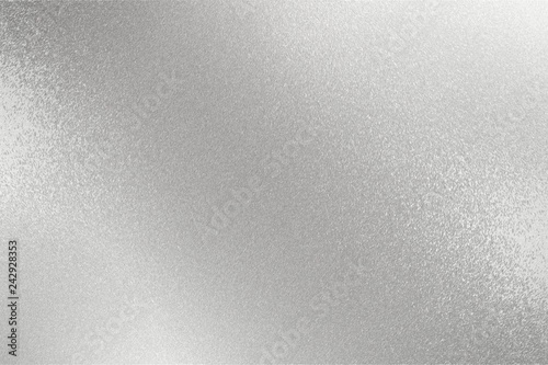 Texture of reflection on rough silver metal wall, abstract background