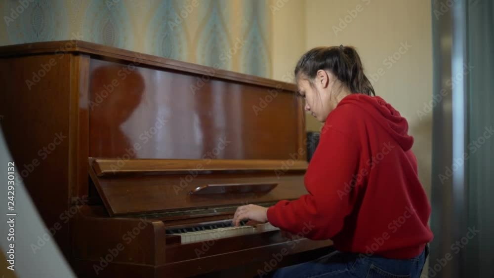 Teen Girl Playing Old Piano Teen Girl Playing Old Piano