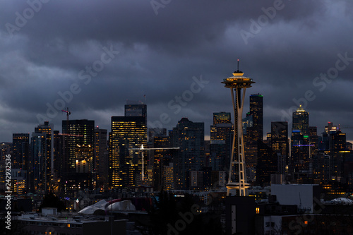 Night view of Downtown Seattle with iconic architect and dark clouds photo