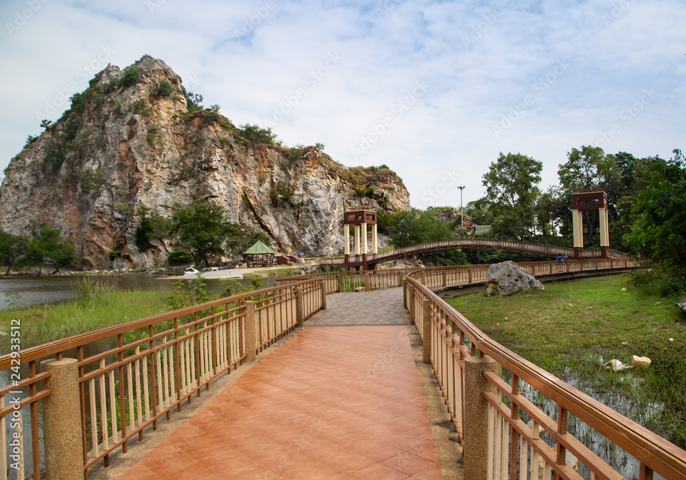 Pathway along the lake with mountain view in Hin Khao Ngu stone park