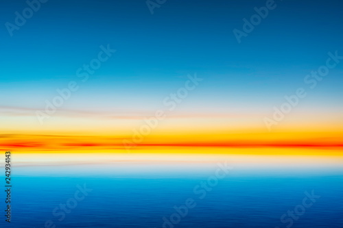 Beautiful blue sky after sunset on sea background.