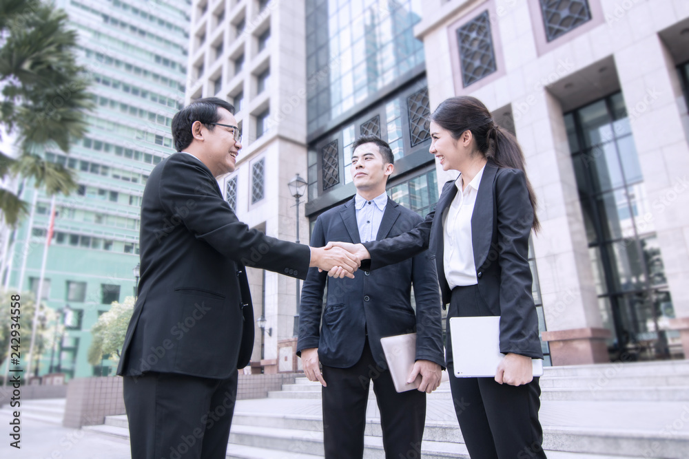 business people negotiate and shake hands after successful agreement business people negotiate and shake hands after successful agreement