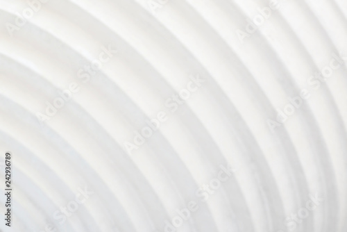 Decorative white cement wall background of abstract waves.