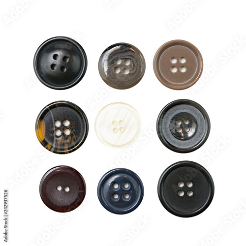Multi-colored plastic sewing buttons on isolated background 