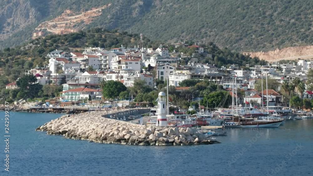 Beautiful mediterranean town Kas in Turkey. Kas lighthouse and harbour at daytime Beautiful mediterranean town Kas in Turkey. Kas lighthouse and harbour at daytime