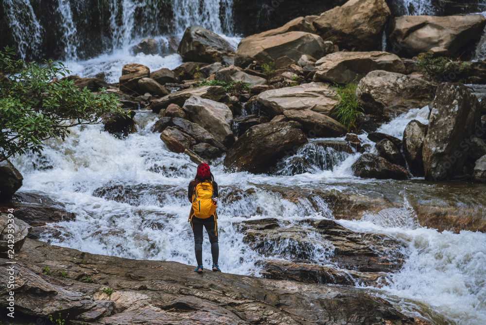 Obraz premium Travel relax to visit the waterfalls of couples. In the winter. at the waterfall mae ya chiangmai. travel nature. summer.