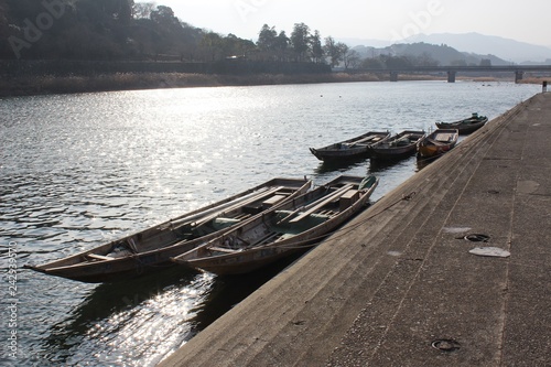 Empty recreational boats moored at a riverbank of the Kuma River in Japan
