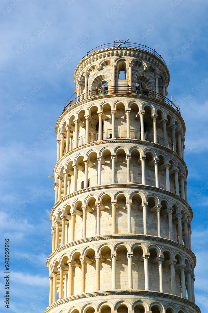 Leaning tower of Pisa, symbol of Italy, closeup view with blue sky on the background, Tuscany, Italy