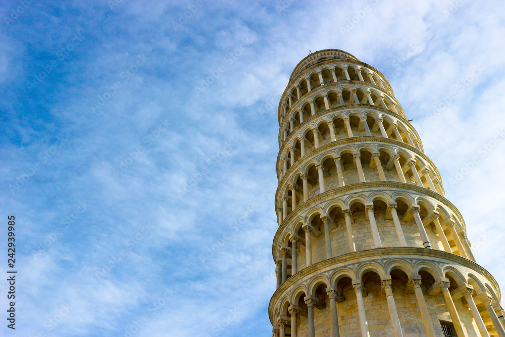 Leaning tower of Pisa, symbol of Italy, closeup view with blue sky on the background, Tuscany, Italy