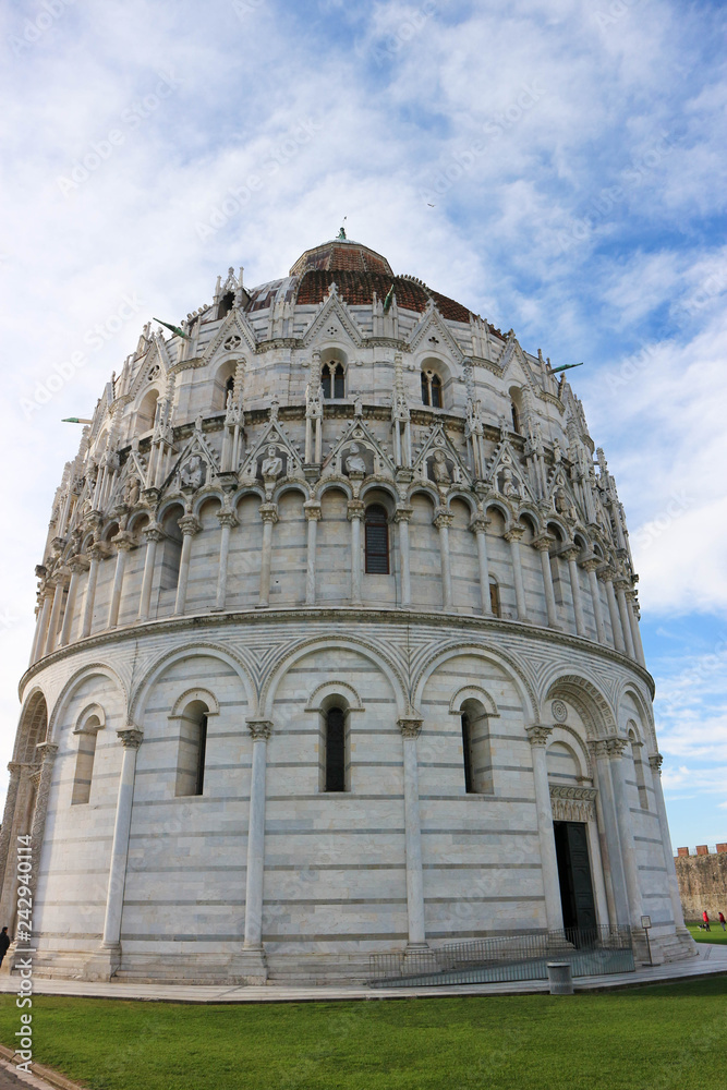 Closeup view to Pisa baptistery on the piazza dei miracoli (square of miracles), Tuscany, Italy