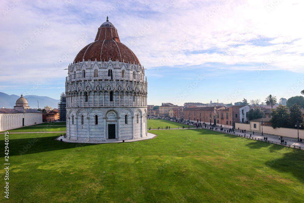 Pisa Baptistery of St. John with a green lawn in front of it, Piazza dei Miracoli (Square of Miracles), Pisa, Tuscany, Italy