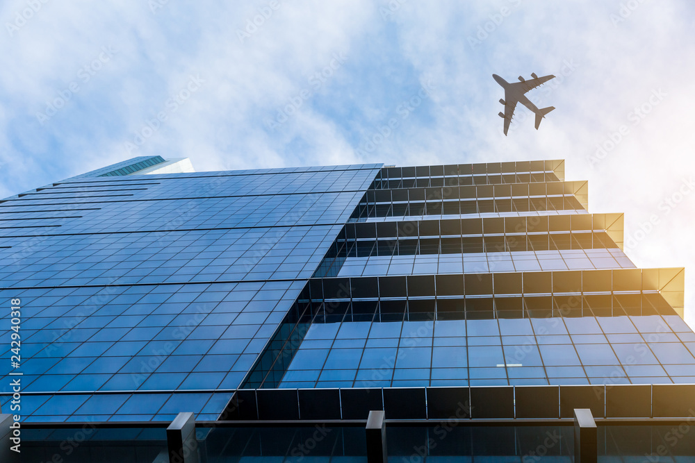 Airplane above business city Airplane above business city