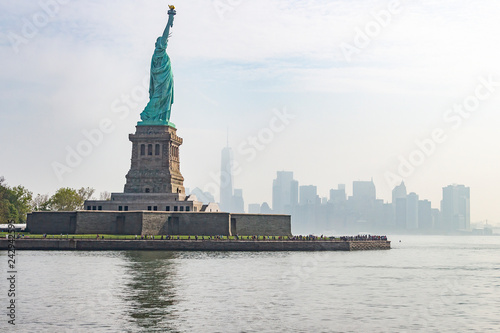 The statue of liberty with Manhattan in the background, New York, United States © Emma