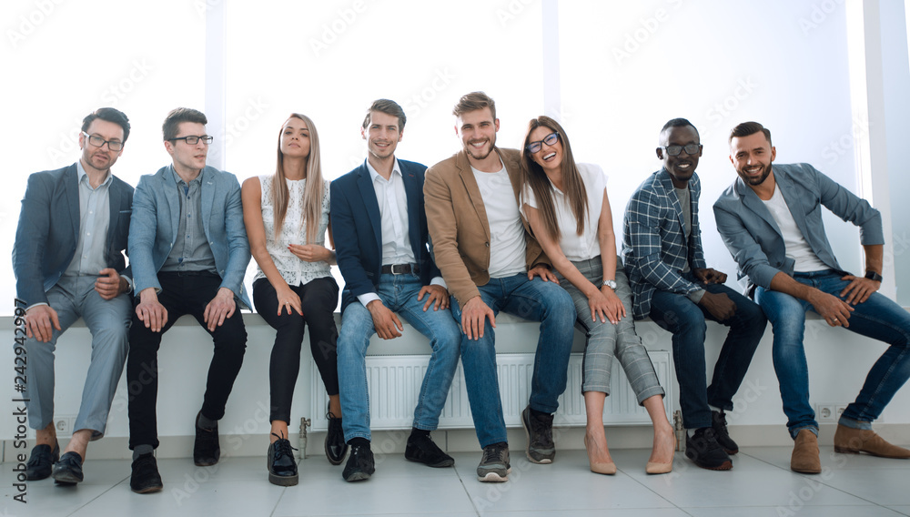 Obraz premium young people are waiting for an interview, sitting in the office lobby