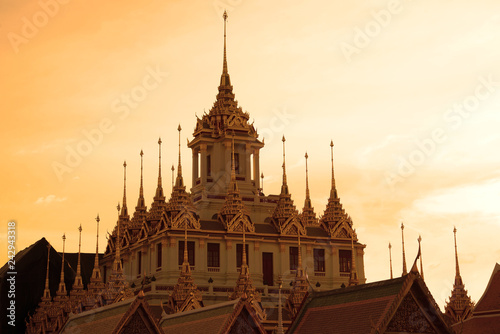 Canvas Print Chedi Loha Prasat of the Buddhist temple Wat Ratchanadda against the background of the sunset sky