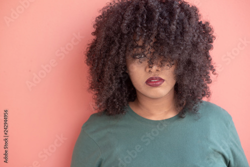 Portrait of a woman with big curly hair 