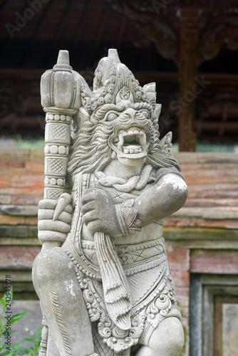 Hindu stone statue at Pura Tirta Empul Temple, a Hindu Temple on Bali, Indonesia, Asia © akturer