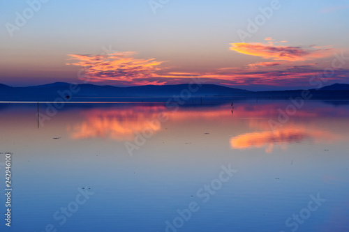 View of sunrise in lagoon Orbetello on peninsula Argentario. Italy © Elena Odareeva