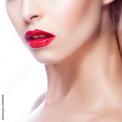 Part of girl face with bright red lips  clean skin. White background
