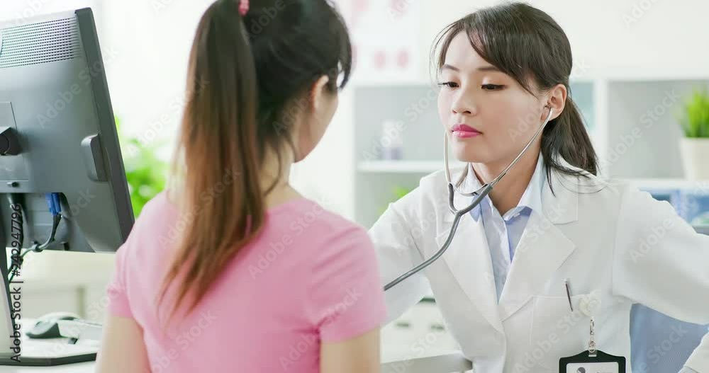 female doctor examining patient female doctor examining patient
