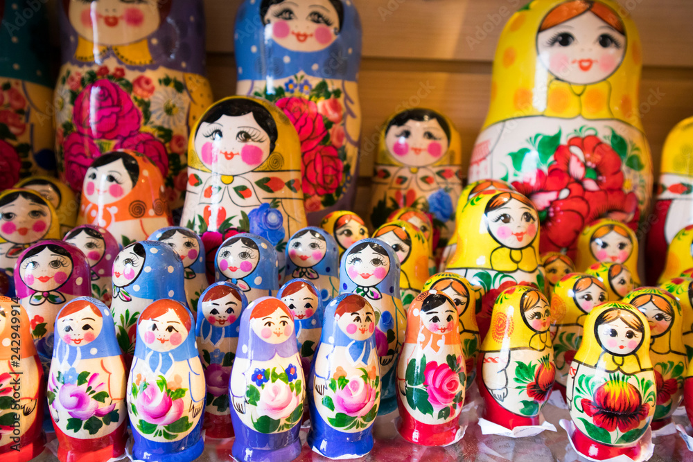 Dolls, Matryoshka Doll, in Gift Shop Shelf. Colorful Set of Various Wooden Stacking Women Figure Dolls in Traditional Old Russian Clothes.