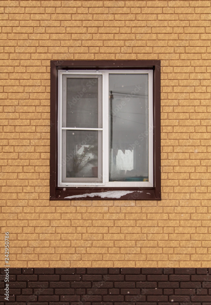 Window in a new brick house as a background Window in a new brick house as a background