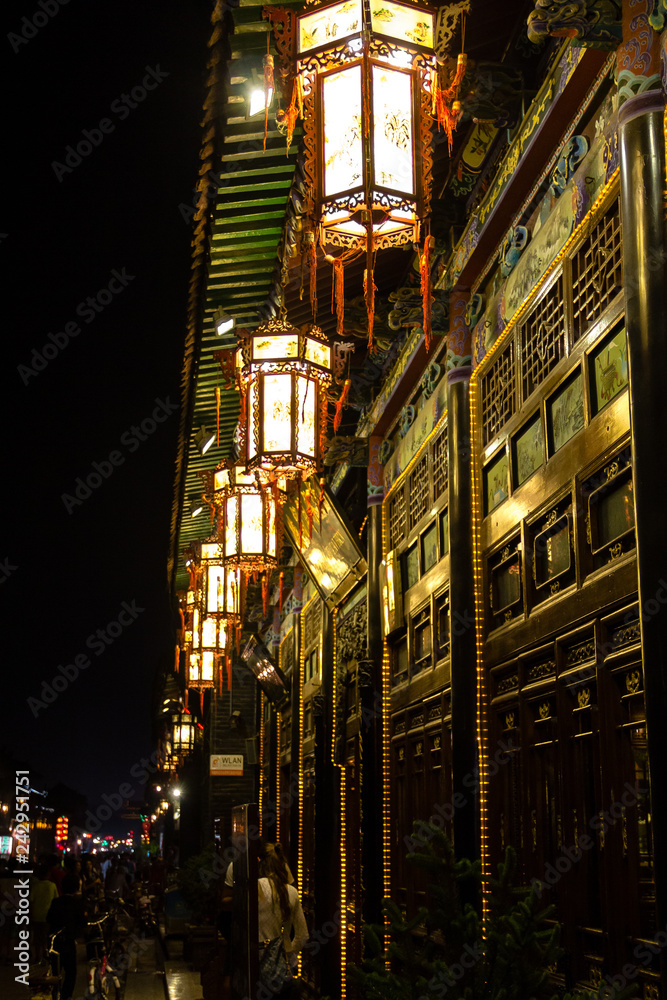 Aug 2013 - Pingyao, Shanxi, China - Traditional lamps at night in Pingyao South Street, one of the main of the Old town. Pingyao is a UNESCO world Heritage site