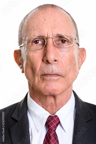 Face of senior businessman wearing eyeglasses isolated against white background