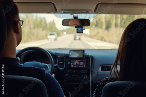 European spouses are travelling by car alongside the countryside roads. They are getting new experience. © Artem