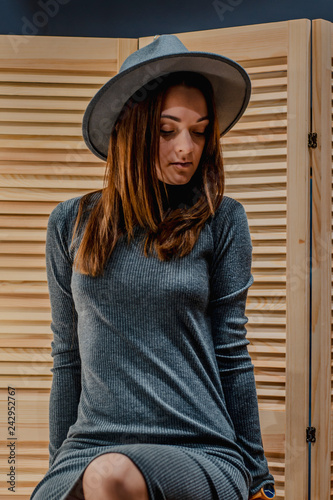 beautiful girl dressed in soft clothes and hat Fedora. Clothes Shop Costume Dress Fashion Store Style Concept