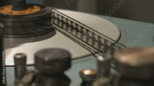 Film rolling reel in old film editing equipment start and stop