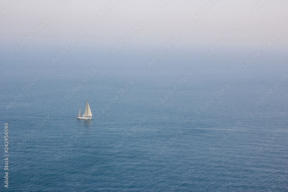 Sailing ship on the blue sea