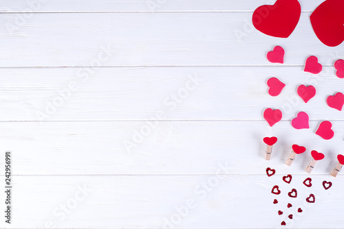 Valentine's day background with red hearts on wooden planks. View from above. Valentines Day concept