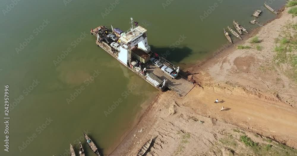 aerial static view of a ferry moored in the riverbank aerial static view of a ferry moored in the riverbank