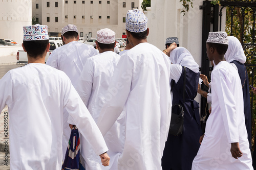 Group of Omani boys in traditional clothes photo