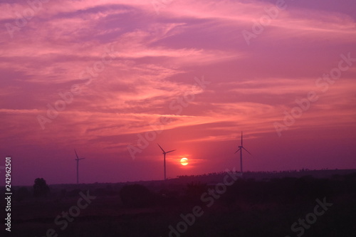 A Beautiful sunset while the windmills giving a perfect click