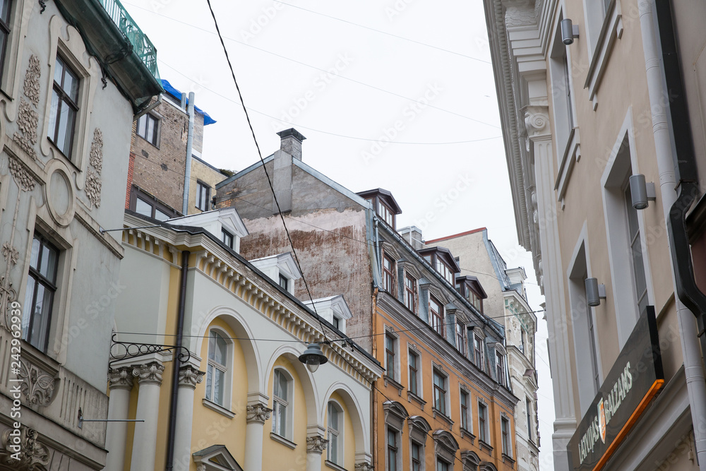 Old city streets, tourists and architecture. Old houses, streets and urban view. Travel photo 2019.