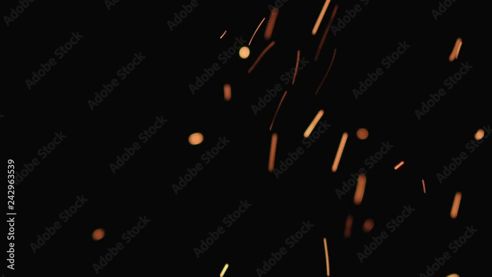 Slow motion hot sparks falling from above black background, 180fps Slow motion hot sparks falling from above black background, 180fps