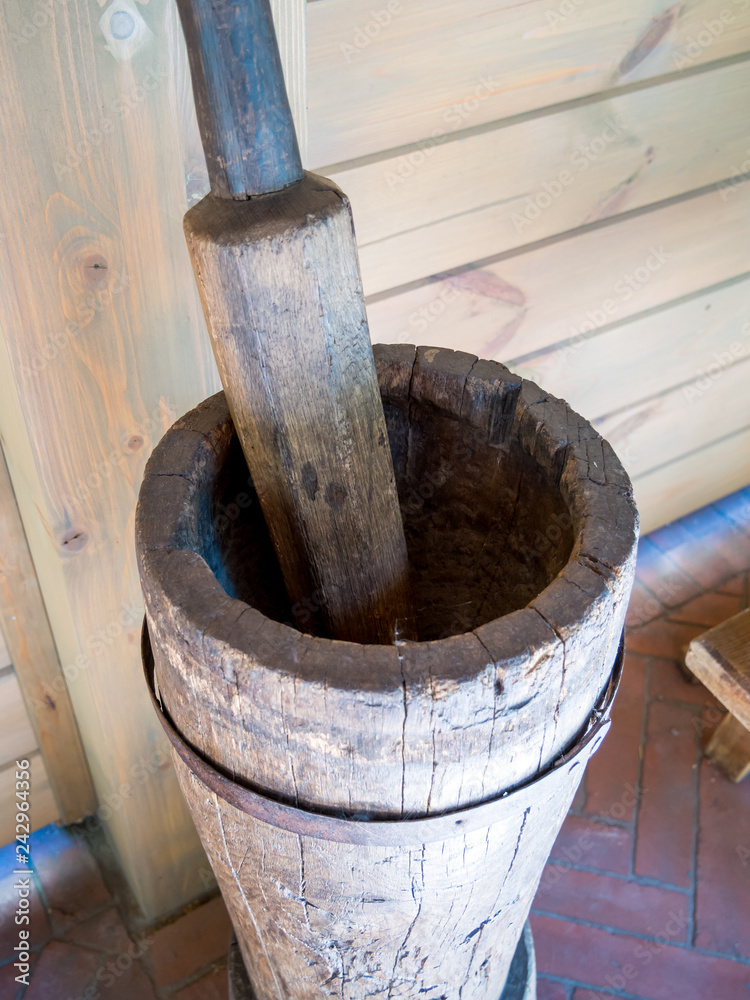 Old stupa and pestle made of wood Old stupa and pestle made of wood
