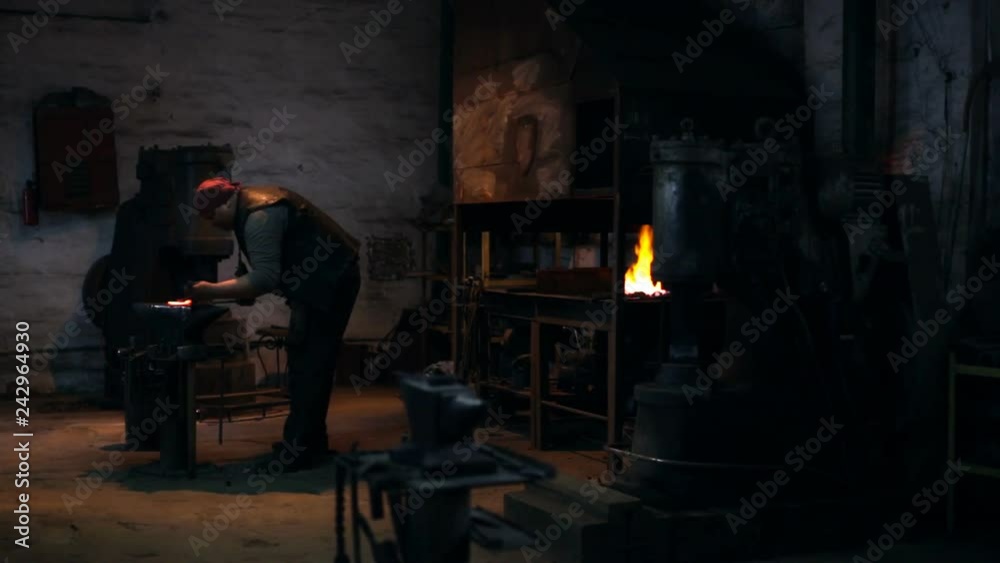 Blacksmith is hammering the horseshoe Blacksmith is hammering the horseshoe
