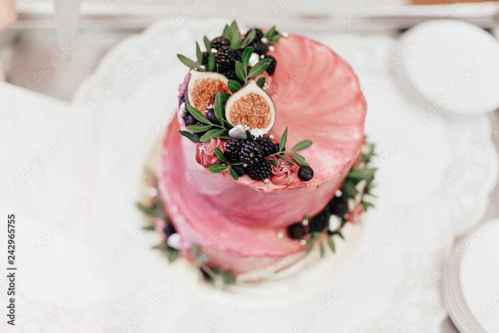 wedding cake with flowers and fresh berries