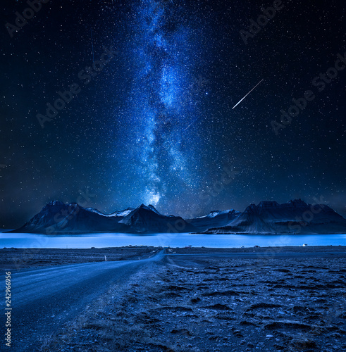 Mountain peaks, fjords and milky way in Iceland at night