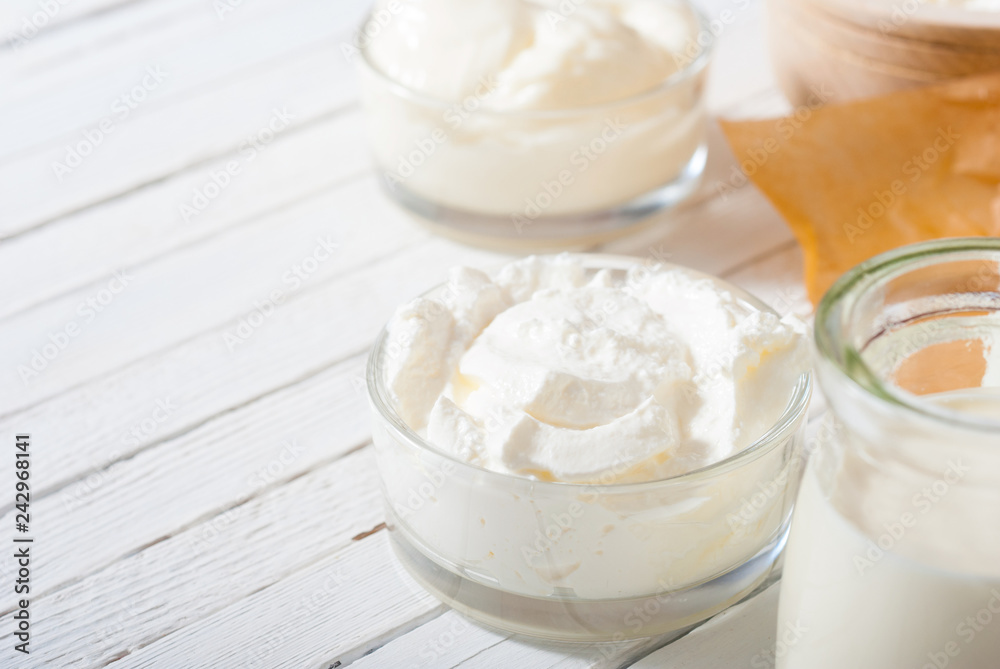 dairy product samples on white wood table background dairy product samples on white wood table background