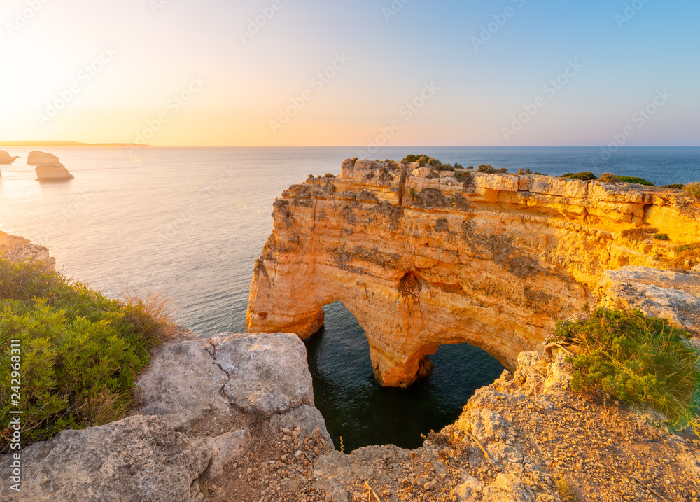 Heart Shaped arch rock in Algarve, Portugal. Praia da Marinha
