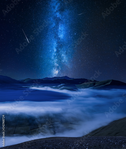 Milky way over foggy valley...